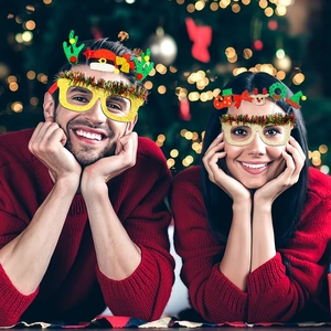 Festive Christmas party glasses set with glitter reindeer antlers and Santa hat decorations