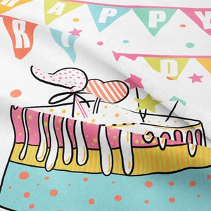 Close-up of birthday cake print on fabric showing fine texture and vibrant colors