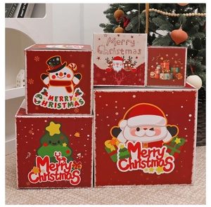 Detailed stack of five red Christmas nesting gift boxes featuring classic holiday patterns
