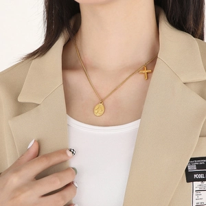 Gold titanium steel necklace with oval Virgin Mary medal and small cross pendant