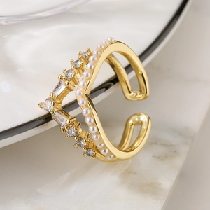 Elegant gold double V-shaped open ring featuring pearls and clear zircon gemstones