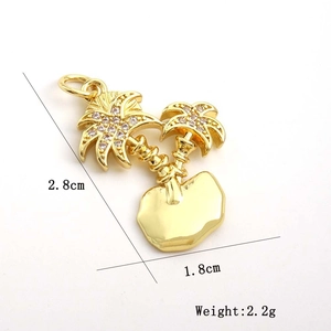 Detailed view of gold coconut tree pendant with zircons, size 2.8cm by 1.8cm