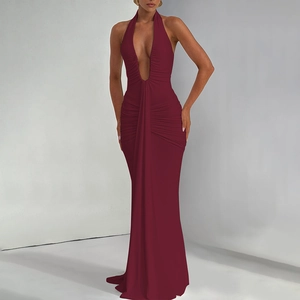 Detail of wine red halter dress showing deep V-neckline and ruched waist texture