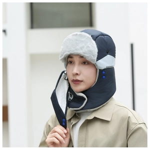 Detailed view of navy blue winter trapper hat with warm faux fur lining and face mask