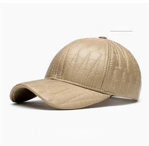 Detail of khaki PU leather baseball cap featuring quilted diamond patterns and windproof texture