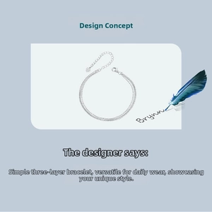 Detailed view of s925 silver triple-layered chain bracelet with heart pendant charm