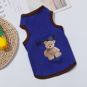 Detail of blue breathable cotton pet vest featuring cute teddy bear print and brown piping