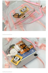 Detail of transparent PVC tote bag with pink nylon handles showing spacious interior capacity