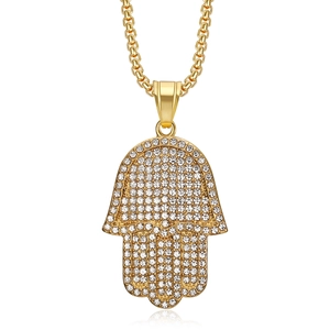 Iced out gold Hamsa Hand pendant with rhinestones on a Cuban link chain for hip hop style