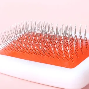 Pet grooming brush with metal needles and protective massage tips for cats and dogs