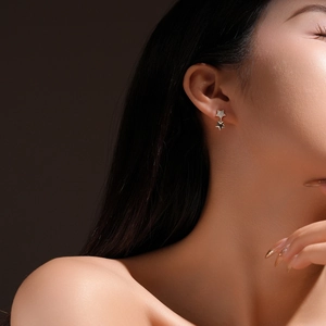 S925 sterling silver star stud earrings featuring double layered stars with sparkling crystals