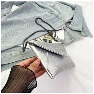Silver envelope clutch featuring skull embossed pattern and dark metal chain strap