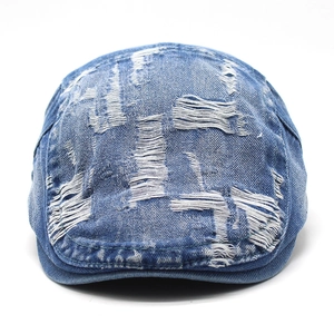 Berretto piatto in denim blu scuro vintage con texture consumata in stile retrò