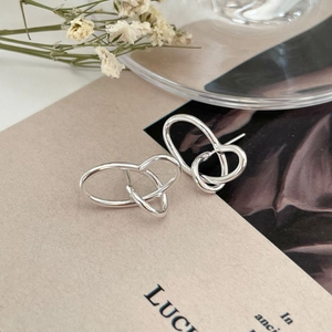 Minimalist 925 sterling silver interlocking hoop earrings with a modern woven texture