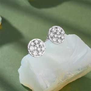 Macro detail of silver geometric pavé circle stud earrings with cubic zirconia