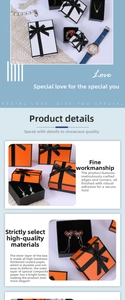 Detail of premium orange jewelry box with black trim and elegant bow ribbon packaging