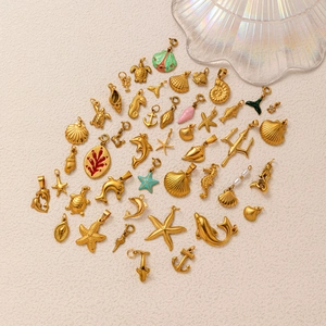 18K gold plated stainless steel ocean charms including starfish, seahorse and dolphin
