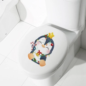 Detail of Christmas penguin toilet sticker with colorful lights and candy cane decor