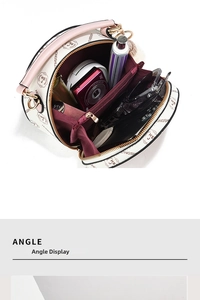 Top view of circular crossbody bag interior showing storage for camera and cosmetics