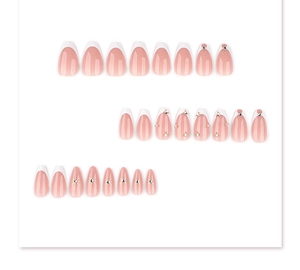 Detail of 24pcs almond press-on nails featuring white French tips and sparkling rhinestones