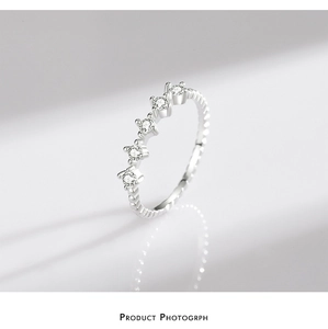 Detailed view of S925 sterling silver ring with twisted band and five zircon stones