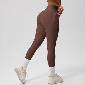 Deep brown high-waisted yoga pants with functional side pocket for phone storage