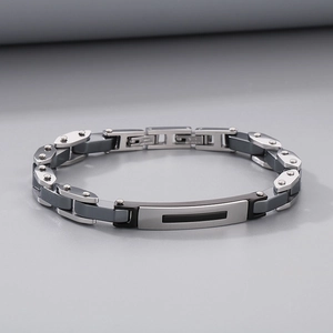 Detail view of industrial style stainless steel link bracelet with matte black finish