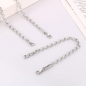 Polished silver rolo chain necklace with lobster clasp and rectangular metal tag