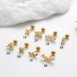 Set of 8 gold stainless steel stud earrings with zirconia stars and flowers