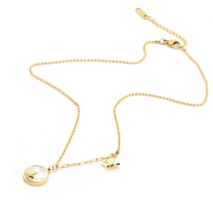 Detail of golden bead chain necklace featuring a white shell pendant with a 3D butterfly