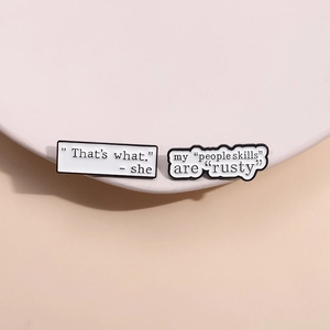 Minimalist enamel lapel pins with funny quotes in classic black and white style