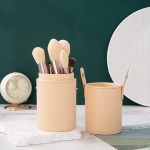 Morandi beige 12pcs makeup brush set with leather storage cylinder on marble table
