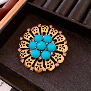 Vintage floral brooch with turquoise beads and pink rhinestones in gold setting