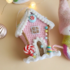 Pink Christmas gingerbread house ornament with candy details and white hanging string