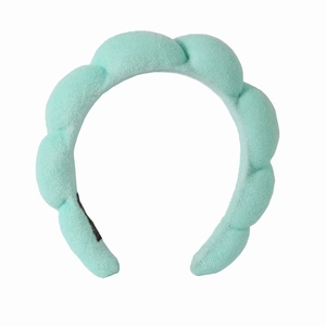 Detail of soft light blue padded sponge headband with fluffy fabric texture for women