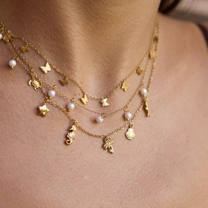 Elegant gold titanium steel layered necklace with shell, butterfly and pearl charms