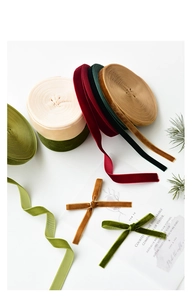 Detail of velvet ribbons in green, red and cream for DIY Christmas tree gift wrapping