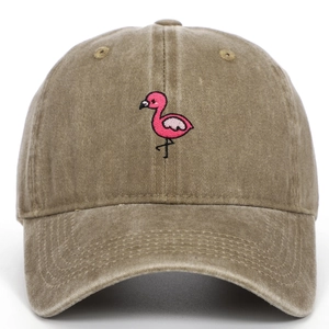 Close-up of pink flamingo embroidery on washed khaki vintage style baseball cap