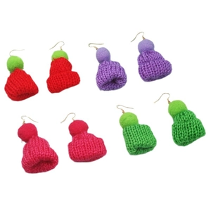 Chic knit mini hat earrings with fluffy pom-poms in four vibrant colors on white background