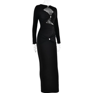 Detail of black slim fit maxi dress featuring cutout waist design with silver ring accents