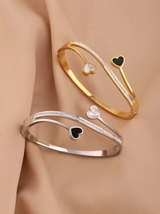 Close-up of double-layered heart bangle with pave crystals and enamel inlay detail