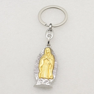 Detailed macro view of the two-tone silver and gold Virgin Mary metal keychain