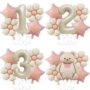 Close-up of cream bear and daisy foil balloon set with number 1 2 3 for birthday decor