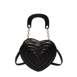 Elegant black heart-shaped handbag with quilted leather finish and gold chain strap