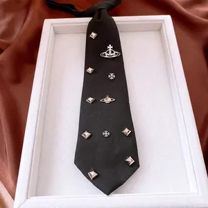 Adjustable black saturn necktie necklace with punk metal studs and cross charms