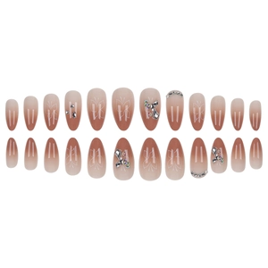 Press-on nails with butterfly print and rhinestones in pink gradient almond shape