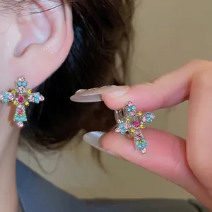 Sparkling cross dangle earrings with colorful pavé rhinestones in silver finish