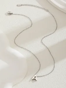 Detail of silver letter A pendant necklace with thin chain and adjustable lobster clasp
