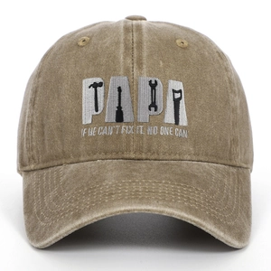 Close-up of PAPA tool embroidery on washed cotton khaki baseball cap for fathers