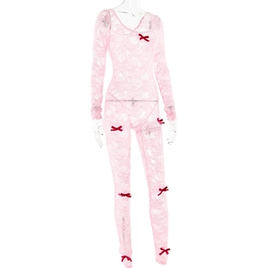 Detailed view of pink lace bodysuit with delicate red bow accents and sheer texture